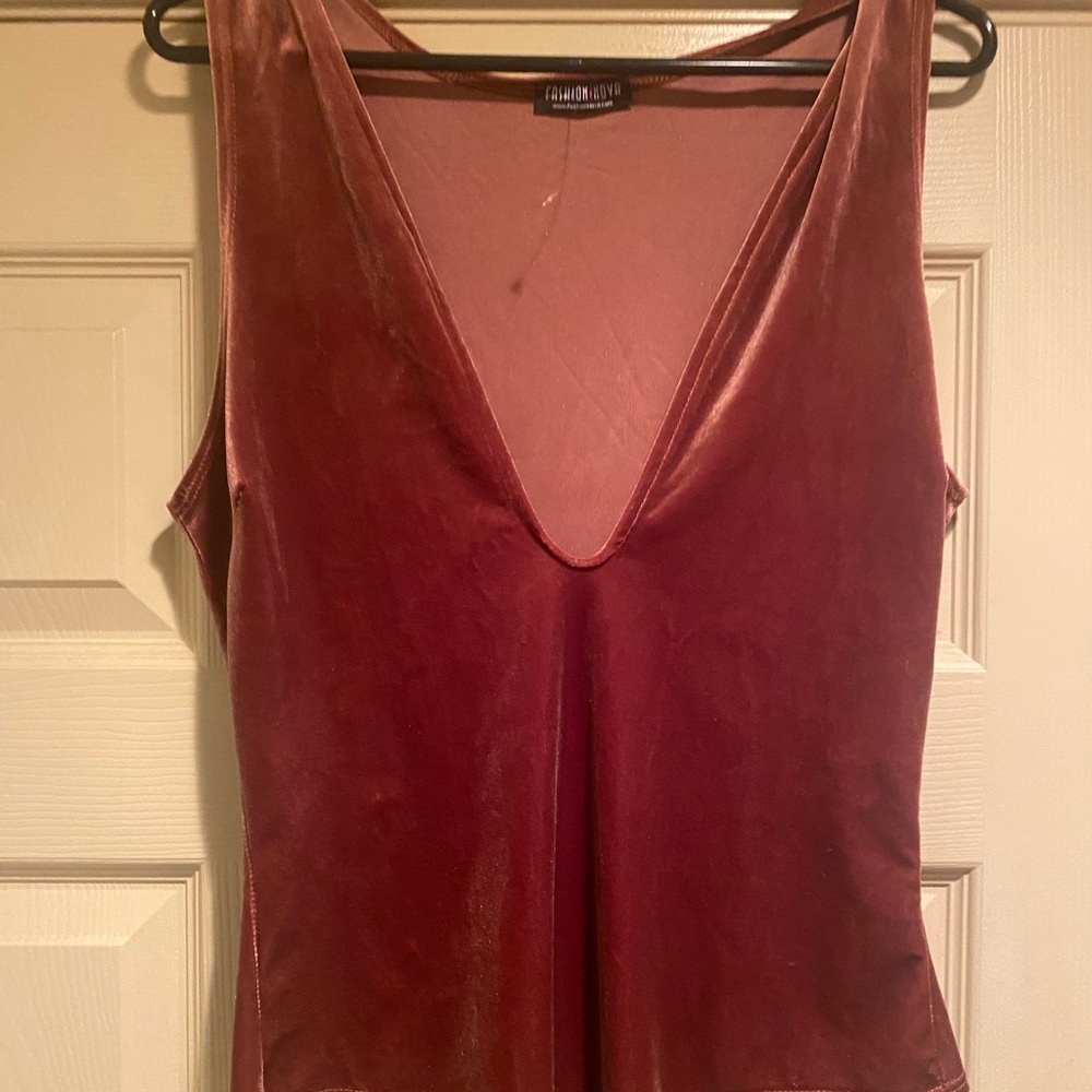 Velvety body suit in rust color